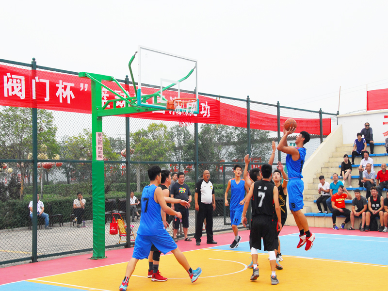 Intense mid-air action shot of a player driving to the hoop at Gaoshan Valve stadium