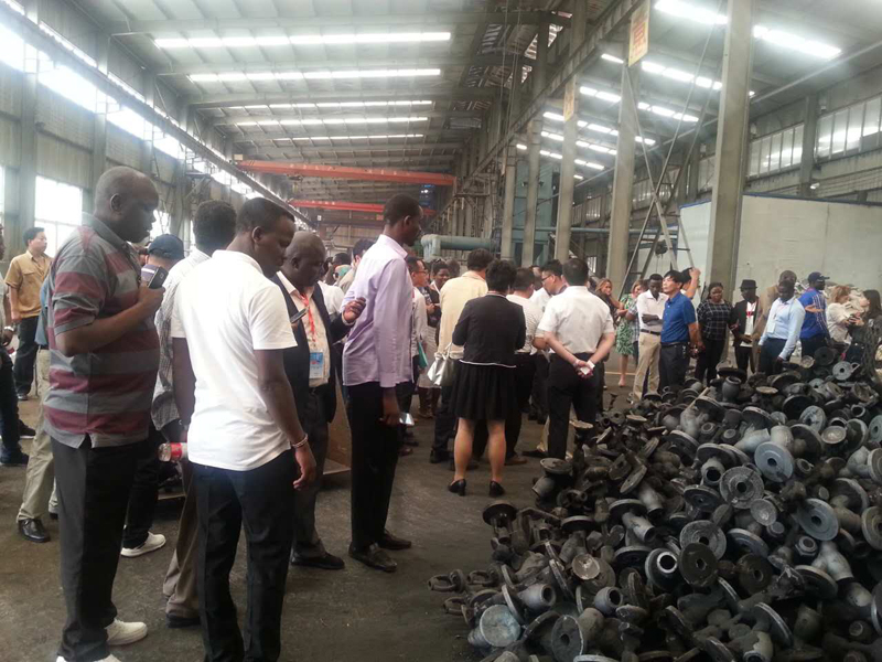 78 international officials touring the heavy casting workshop floor